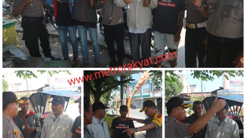 Kapolres Sergai AKBP Robin Simatupang Berikan Nasi Bungkus Kepada Abang Tukang Betor di Simpang Tiga Perbaungan