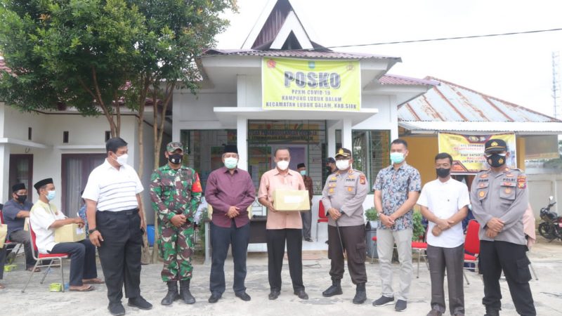 Pandemi Covid-19, Kapolres Siak Dan Bupati Berikan Bantuan Masker, Sembako