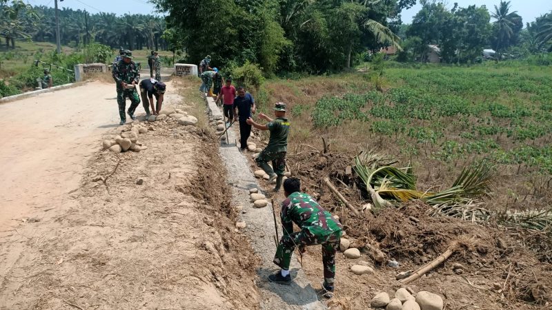 Ikhtiar dan Kerja Keras Satgas TMMD Kodim Deliserdang Mantapkan Konstruksi TPT Sepanjang 72 Meter