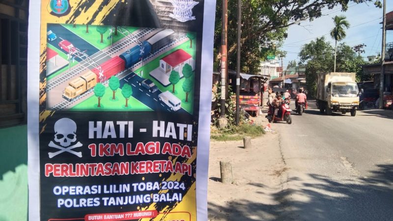 Polres Tanjungbalai Laksanakan Pemasangan Spanduk, Baliho Himbauan OPS Lilin Toba 2024