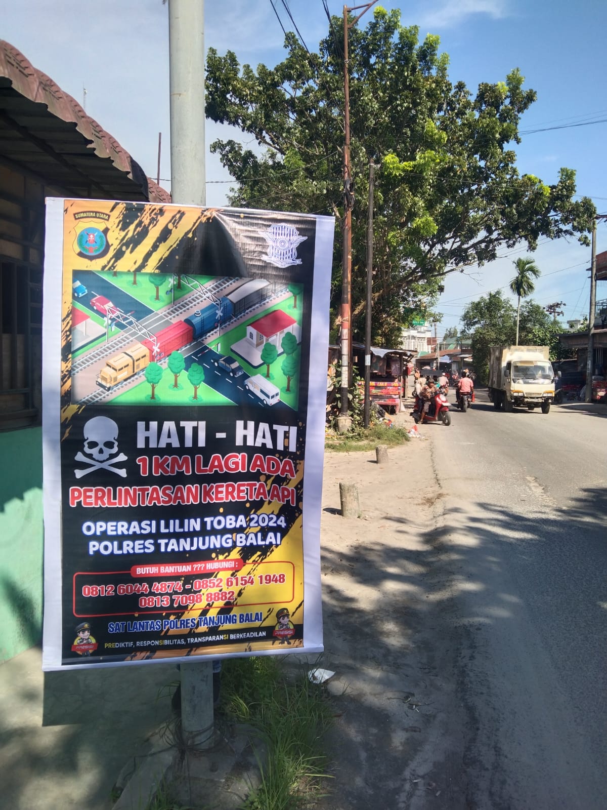 Polres Tanjungbalai Laksanakan Pemasangan Spanduk, Baliho Himbauan OPS Lilin Toba 2024