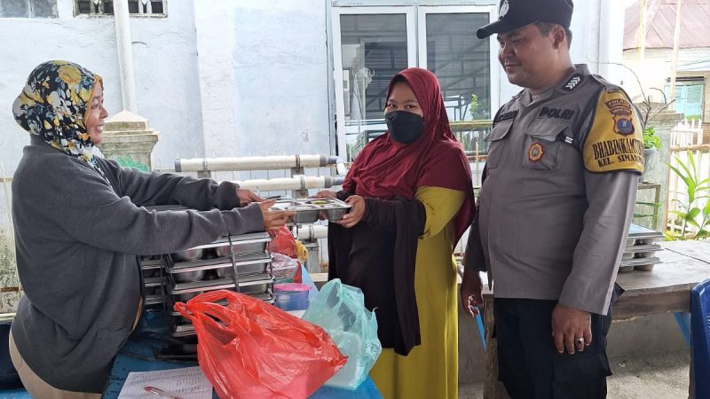 Bhabinkamtibmas Polsek Siantar Marihat Monitoring Distribusi MBG di Posyandu Simarimbun